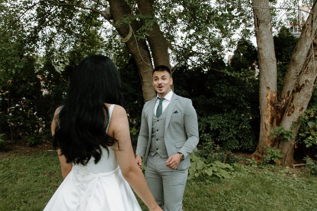 Groom's reaction to backyard wedding first look