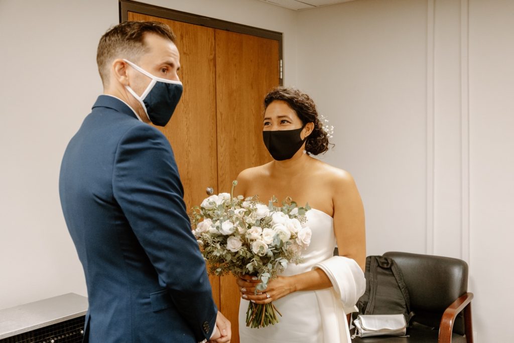 Bride and groom exchange vows at elopement in Chicago City Hall