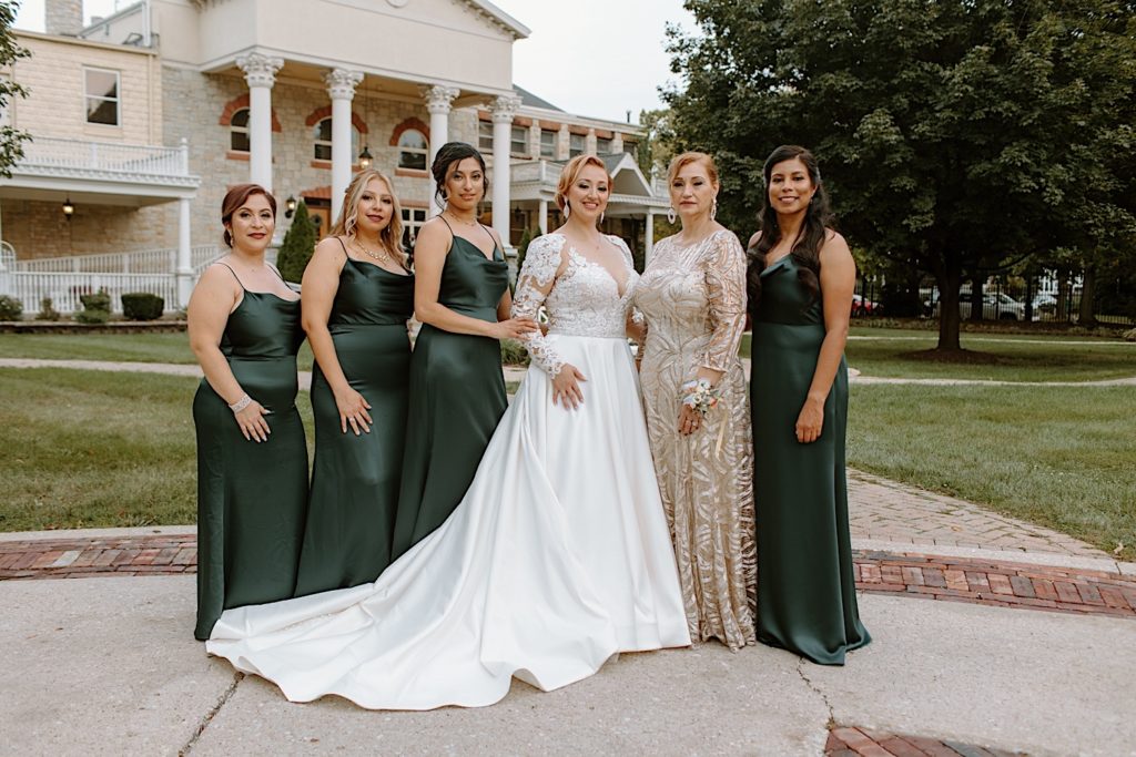 Bride and wedding party in front of Jacob Henry Mansion