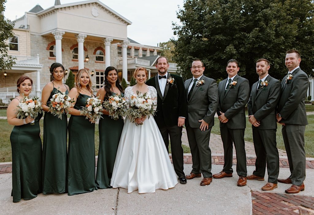 Bride groom and wedding party in front of Jacob Henry Mansion